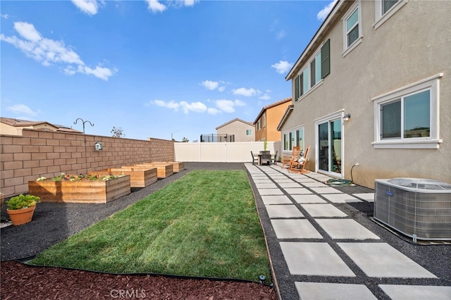 view of yard with cooling unit and a patio