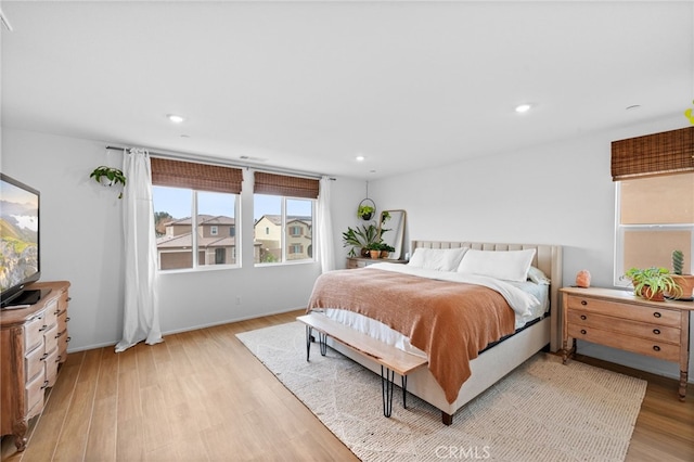 bedroom with light hardwood / wood-style floors