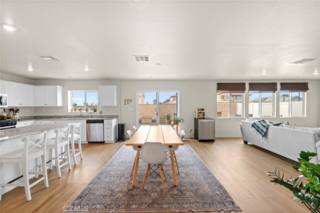 dining room featuring light hardwood / wood-style floors