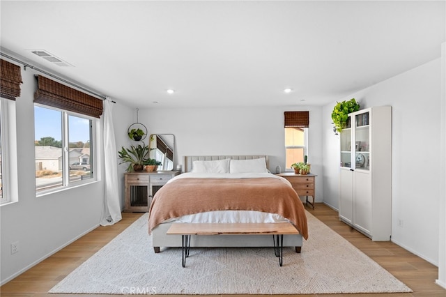 bedroom with light hardwood / wood-style floors