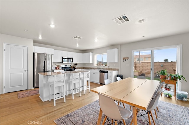 dining room featuring light hardwood / wood-style floors