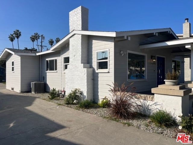 view of home's exterior with central AC unit