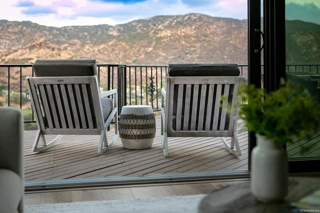 wooden terrace featuring a mountain view