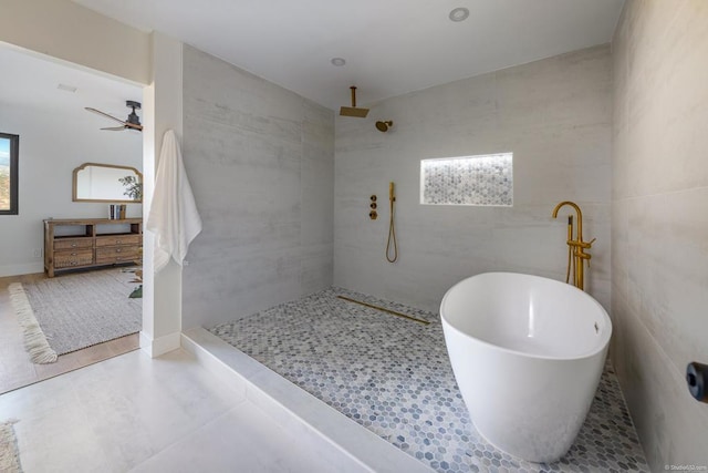 bathroom featuring ceiling fan and plus walk in shower