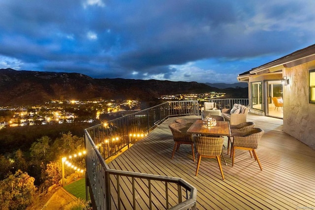 wooden deck featuring a mountain view