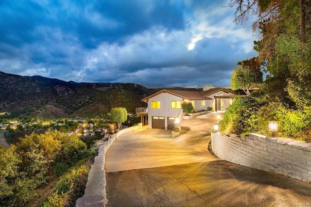 view of front of house with a mountain view and a garage