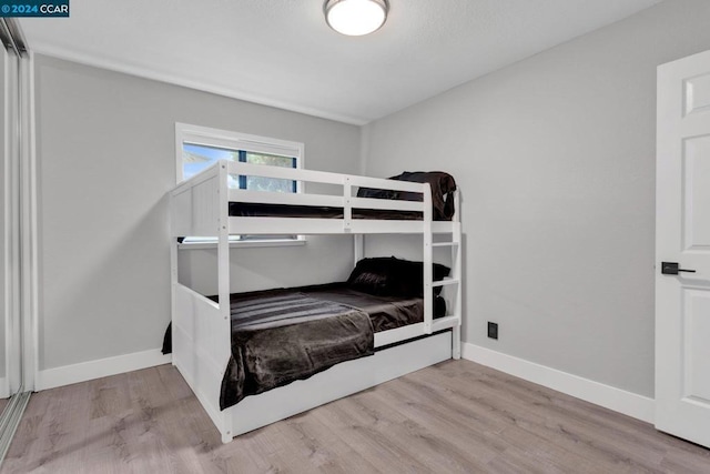 bedroom with light hardwood / wood-style flooring