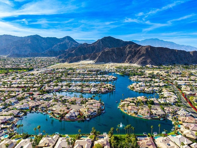 birds eye view of property featuring a water and mountain view