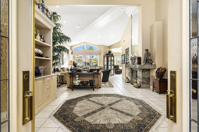 interior space featuring lofted ceiling and light tile patterned flooring