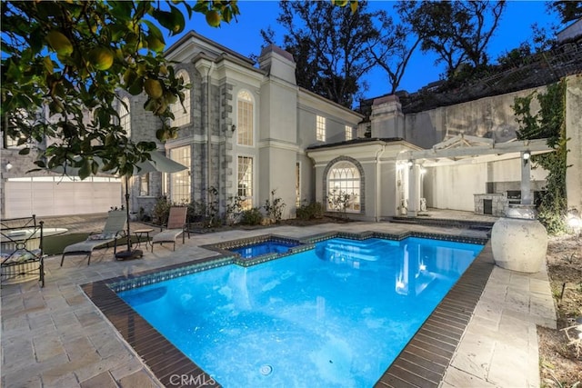 view of pool featuring a patio