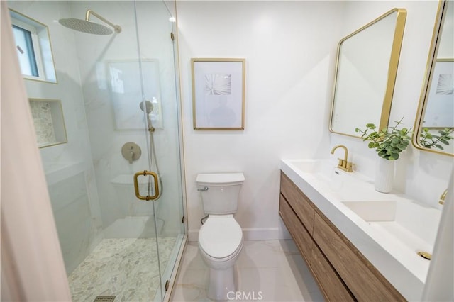 bathroom with double vanity, baseboards, toilet, a shower stall, and a sink