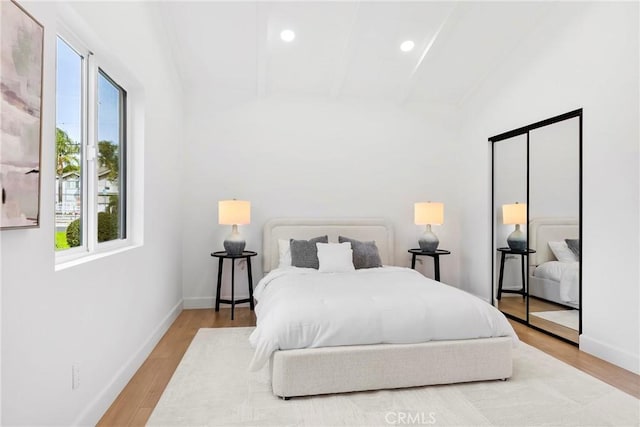 bedroom featuring recessed lighting, wood finished floors, and baseboards