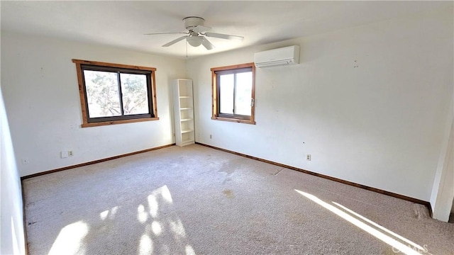 carpeted empty room featuring ceiling fan and a wall mounted AC