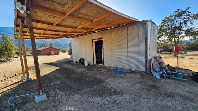 view of outdoor structure featuring a mountain view