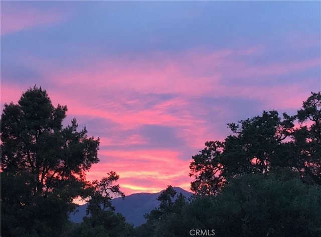 nature at dusk featuring a mountain view