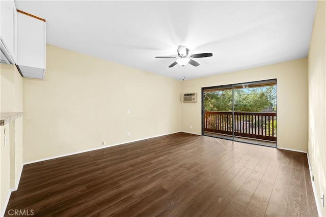 unfurnished room featuring ceiling fan and dark hardwood / wood-style flooring