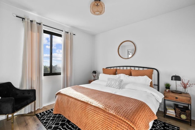 bedroom with wood finished floors