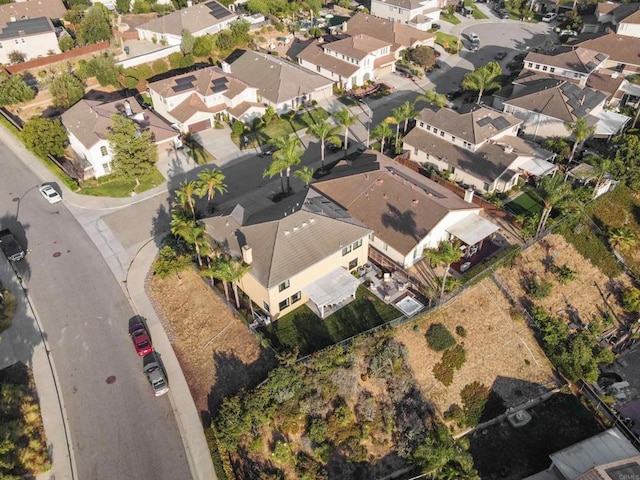 birds eye view of property with a residential view