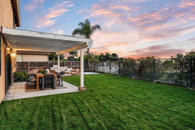 yard at dusk featuring outdoor lounge area, a patio area, a fenced backyard, and a pergola