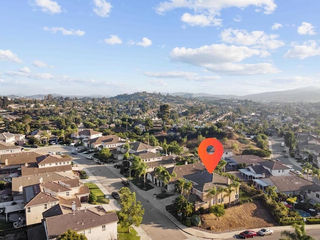 birds eye view of property with a residential view and a mountain view