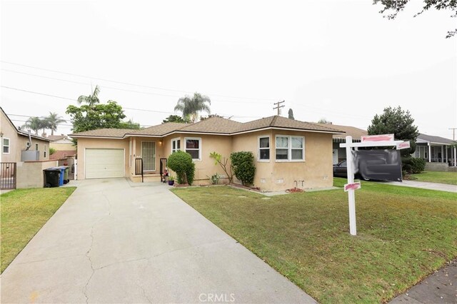 ranch-style house with a garage and a front yard