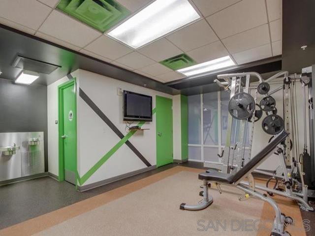 workout area featuring a drop ceiling