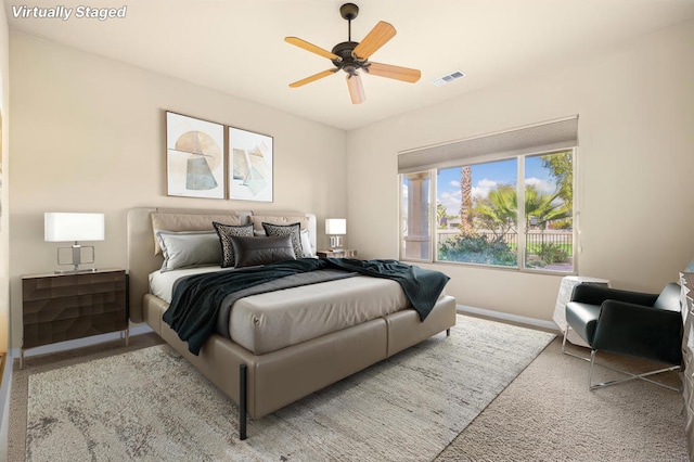 bedroom featuring ceiling fan and light colored carpet