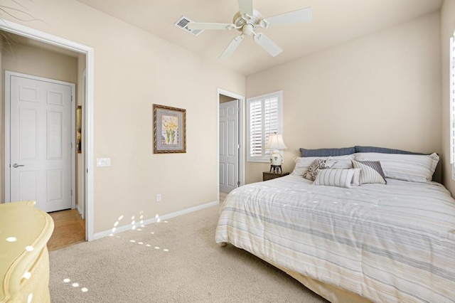 carpeted bedroom featuring ceiling fan