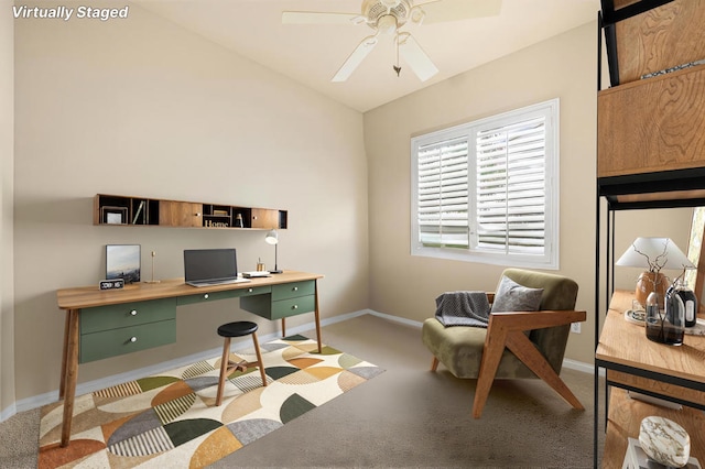 office featuring ceiling fan, light colored carpet, and lofted ceiling