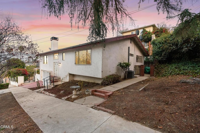 exterior space featuring a garage and central air condition unit