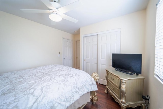 bedroom with ceiling fan and dark hardwood / wood-style flooring