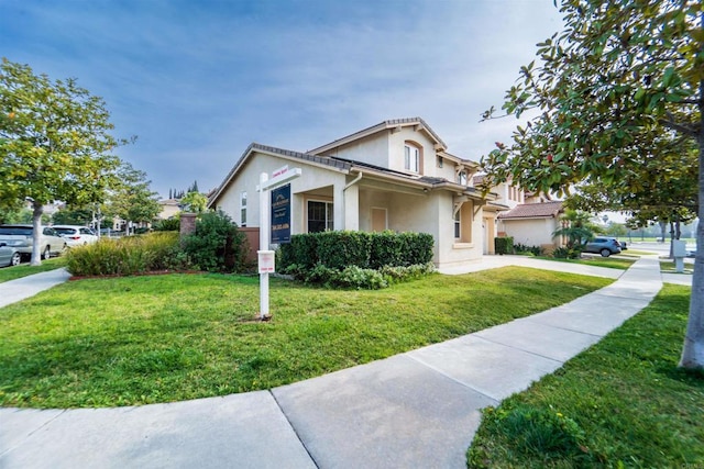 bungalow-style home with a front lawn