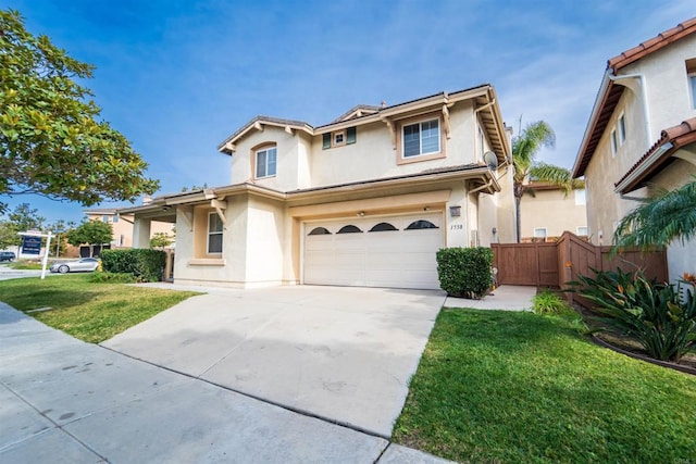 view of front property featuring a front lawn and a garage