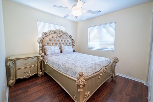 bedroom with ceiling fan and dark hardwood / wood-style floors