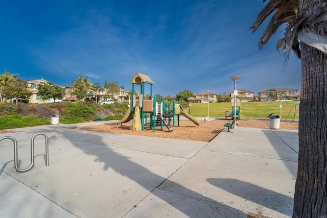 view of jungle gym with a lawn