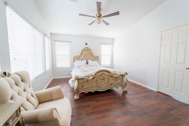 bedroom with dark wood-type flooring and ceiling fan