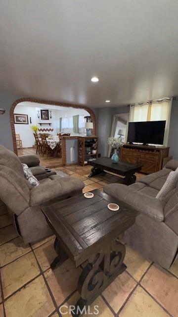 living room featuring light tile patterned flooring