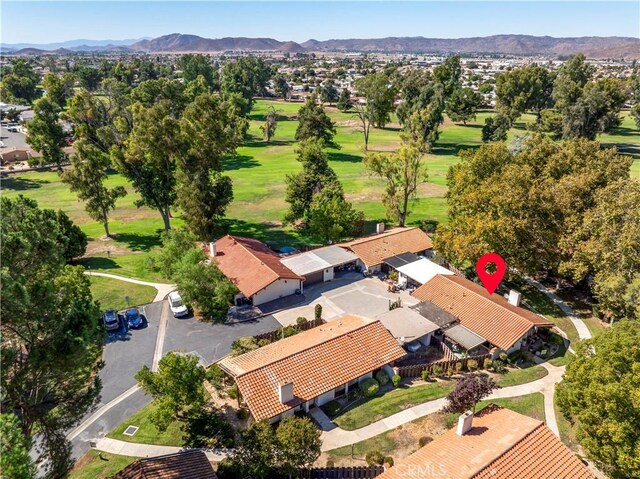 birds eye view of property with a mountain view