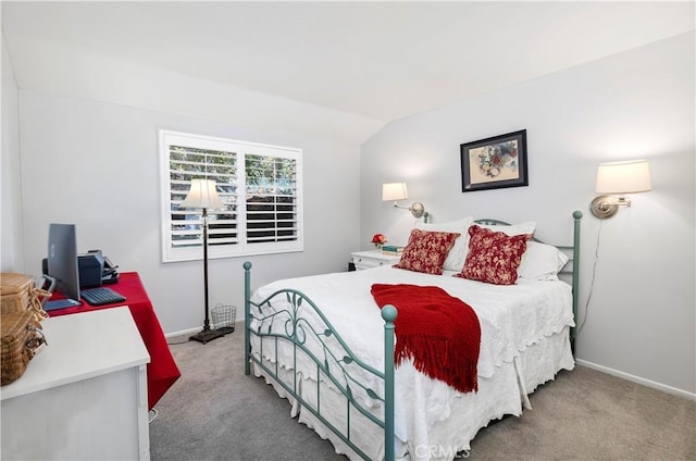 carpeted bedroom featuring vaulted ceiling