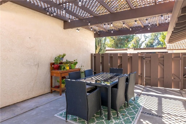 view of patio featuring outdoor dining area and a pergola