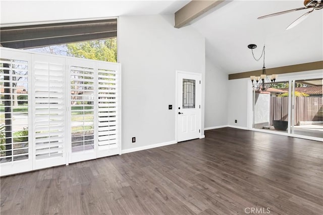 interior space with a wealth of natural light, wood finished floors, beam ceiling, and ceiling fan with notable chandelier