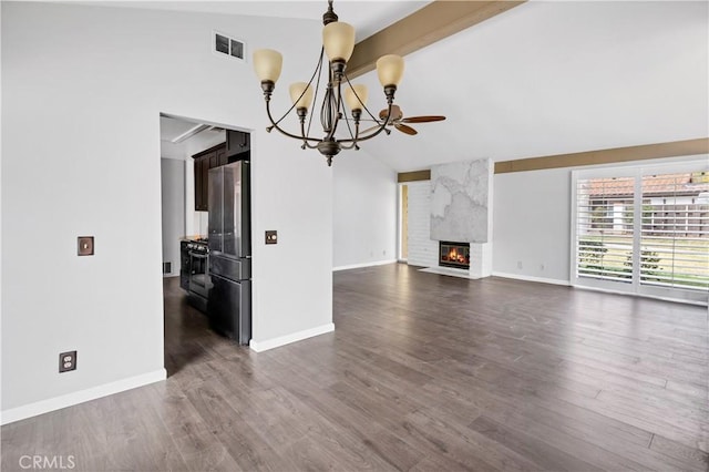 unfurnished living room with vaulted ceiling with beams, a large fireplace, dark wood-style flooring, visible vents, and baseboards