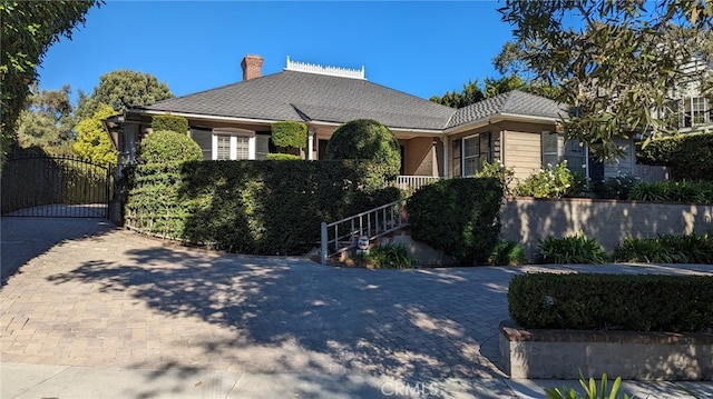 ranch-style house with a gate