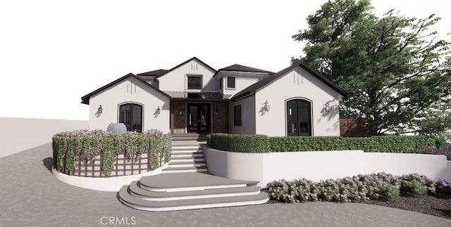 view of front of home featuring stucco siding