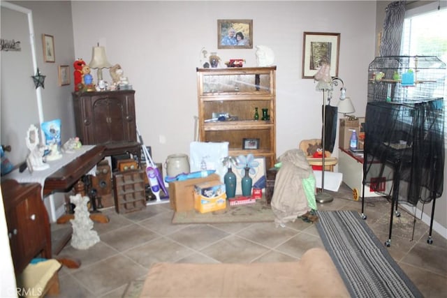 miscellaneous room with tile patterned floors