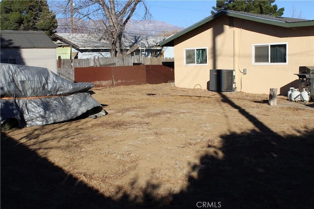 view of yard with a mountain view and cooling unit