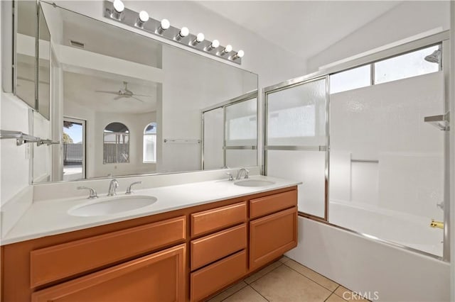 bathroom with tile patterned floors, vanity, vaulted ceiling, ceiling fan, and combined bath / shower with glass door