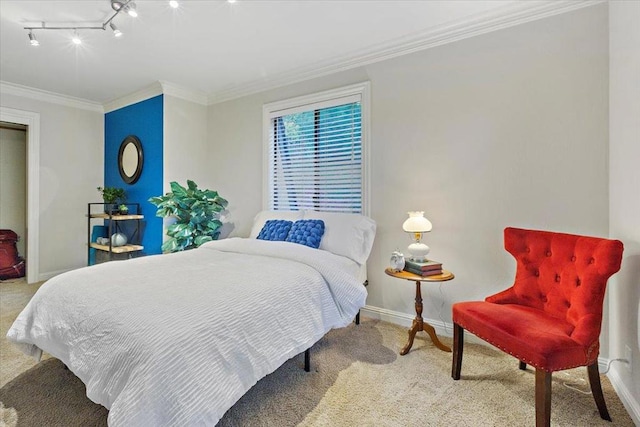 bedroom with light carpet, crown molding, and rail lighting