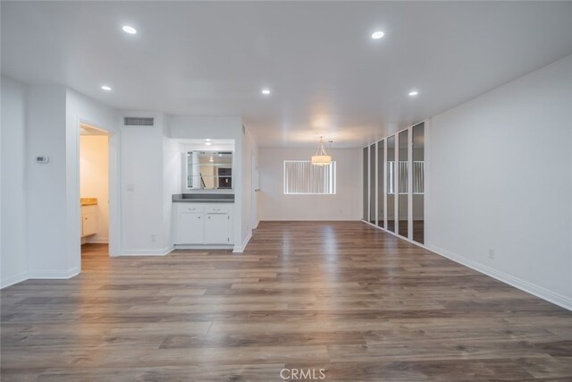 unfurnished living room featuring hardwood / wood-style floors