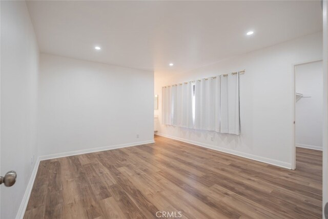 empty room featuring wood-type flooring